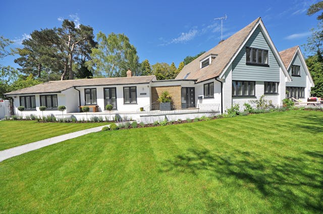home with addition and beautiful lawn