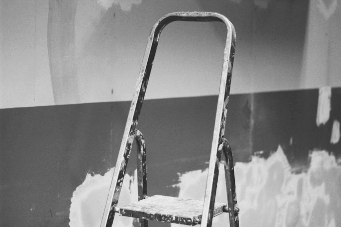 step ladder in a partially painted room
