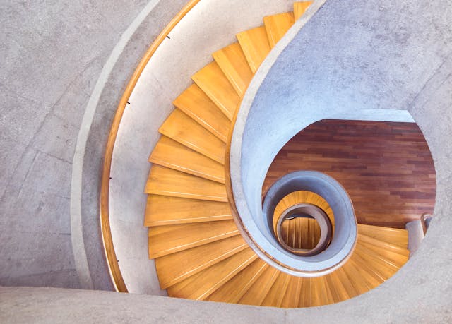 spiral wooden staircase with spiral wooden railing