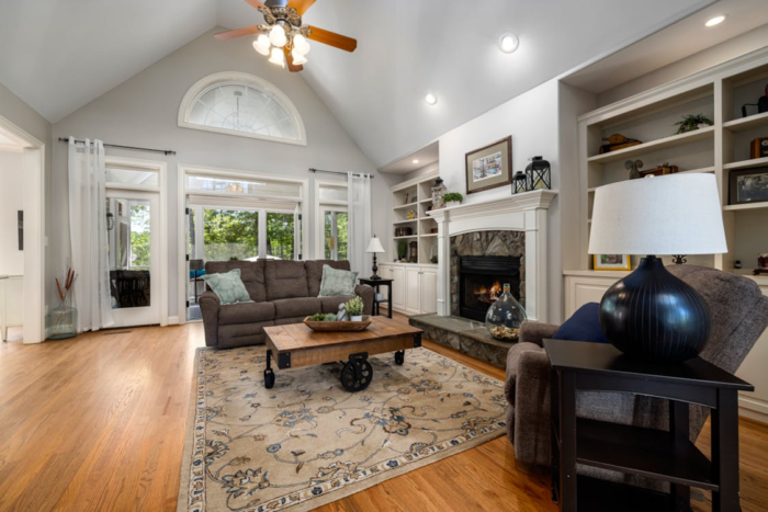 Something’s giving an “unclean” feeling in your home even though you know you just cleaned. Here's what makes a clean house look unclean. large living room with area rug couch ceiling fan fireplace