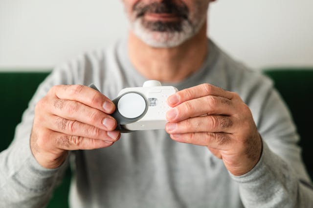 man looking at a mold test
