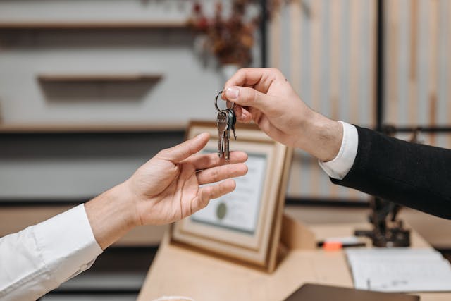 To buy your first home as a single person, here are a few handy tips to help make the process of buying your first home easier. keys being handed to a person