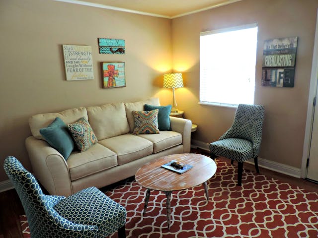 Some living room updates just make sense and can turn a space from boring to something amazing without breaking the bank. living room with beige couch and textile carpet with coffee table