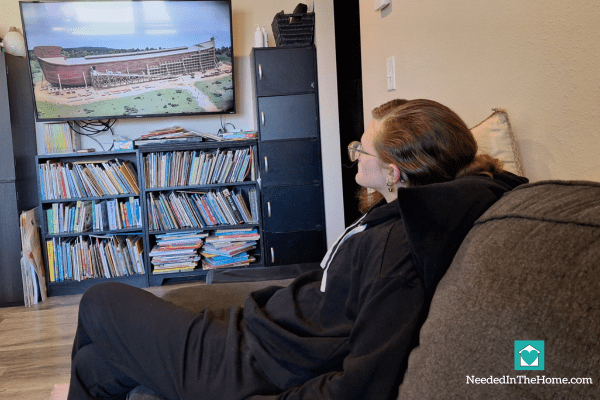 teen girl watching a video from answers in genesis for steadfast high school curriculum