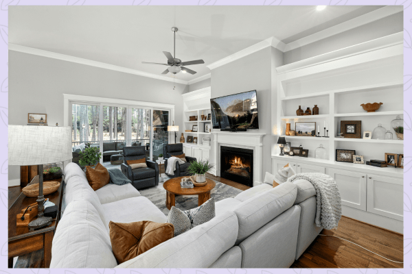 living room with eclectic decor on shelves and tables