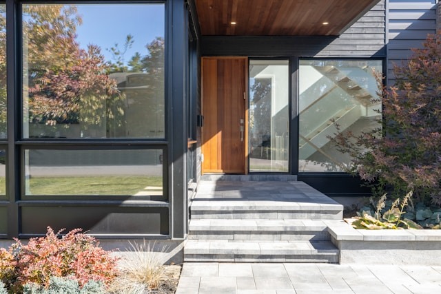 front entryway of home with lots of windows