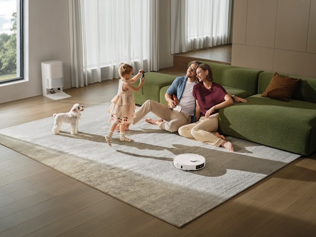 family in living room sitting on the carpet