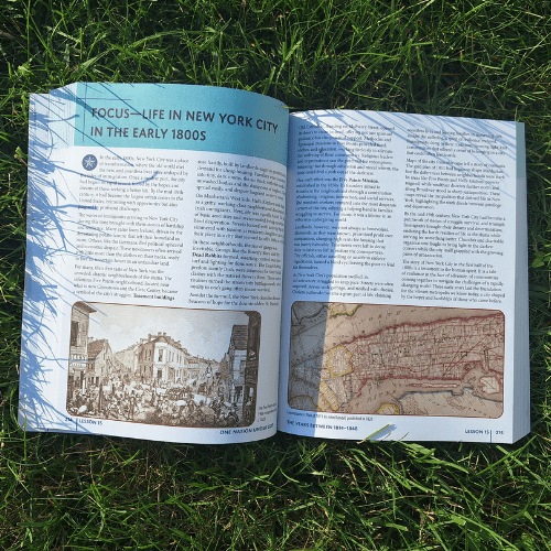 textbook laying on grass opened to a page titled focus life in new york city in the early 1800s