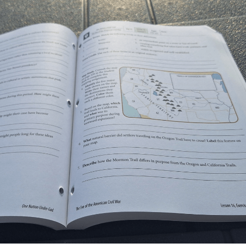 teacher guide open to a worksheet page with a map