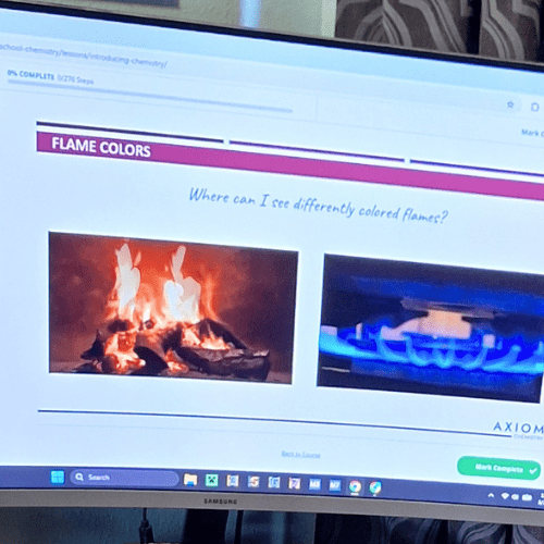 This is our product review of the Axiom Science High School Chemistry online course with 191 videos, 50 self-grading quizzes, and 20 Labs. image of computer screen with axiom chemistry lesson on it