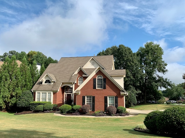 Moving beyond the basic tasks helps secure your investment, improve safety, and ensure your home is prepared for modern challenges. house surrounded by trees and grass