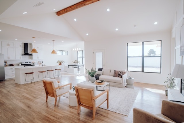With a clear plan, you can get through major home cleanouts with manageable steps and reclaim your space without all the stress. open concept living room dining room and kitchen with slanted ceilings