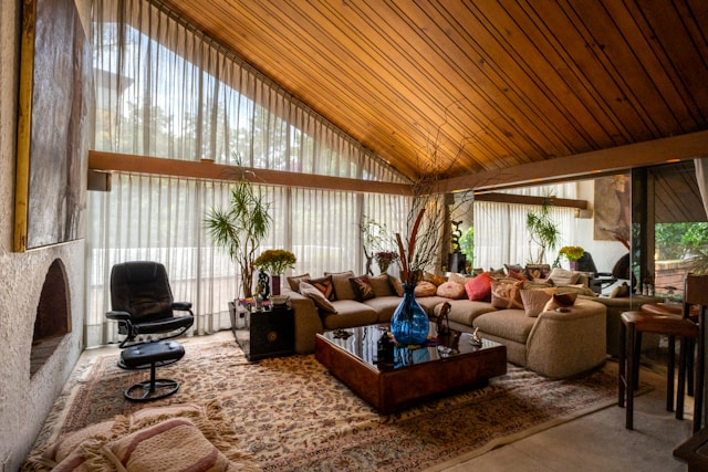 living room with vaulted ceiling large windows fireplace