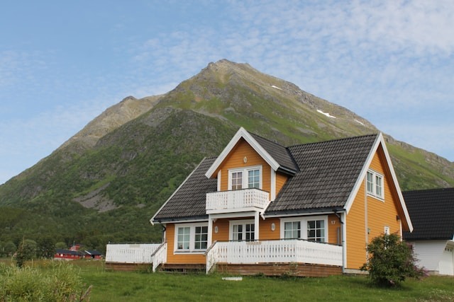 house at foot of a large hill