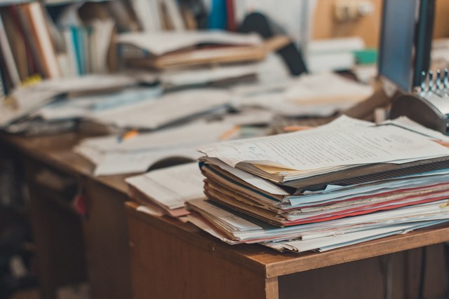 True home data privacy requires a strategy protecting both your digital and physical aspects of your home. desk full of paperwork