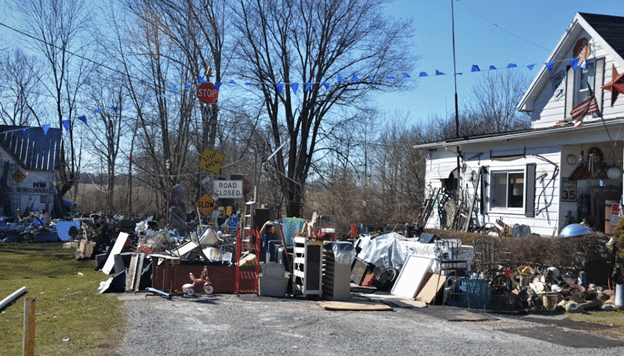 Local junk removal services can handle much of what you need done to do a big clear out, including heavy lifting. lots of garbage outside of a home ready for garbage removal services